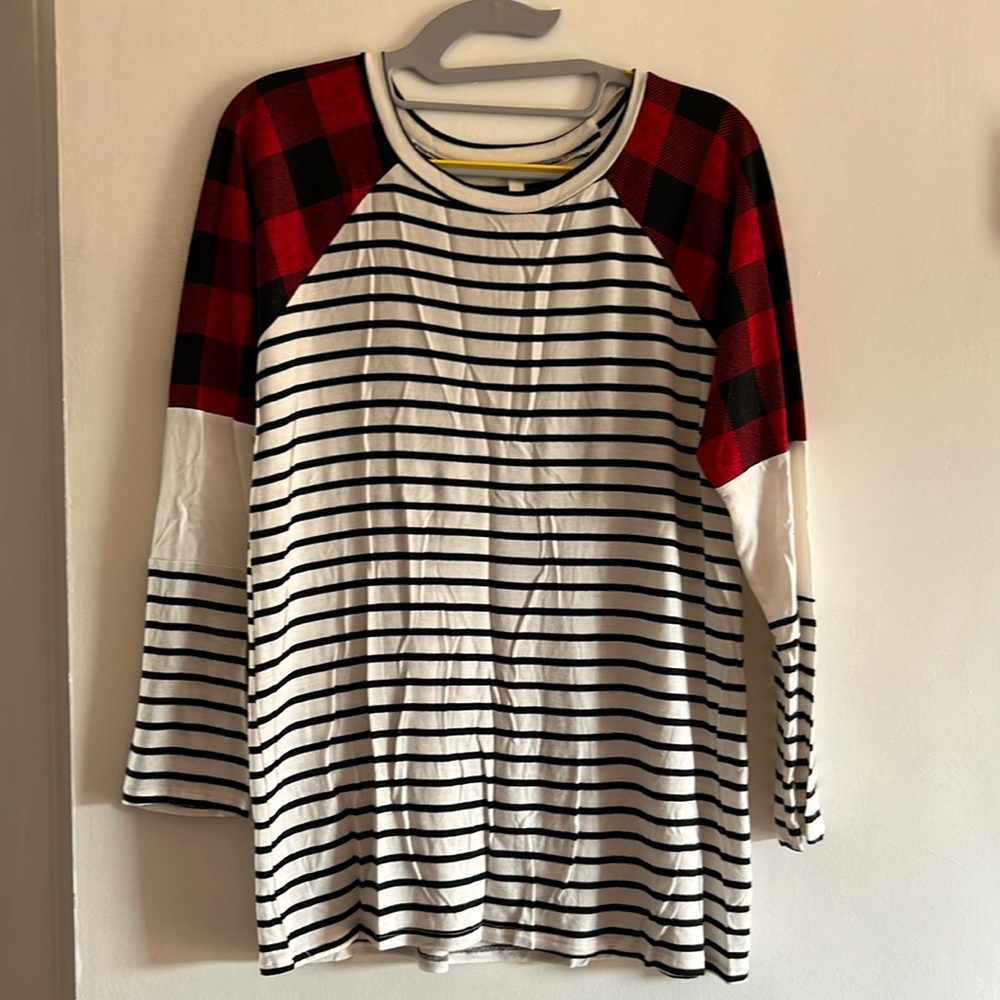 White and black striped tunic style top with Buffalo plaid shoulder accent